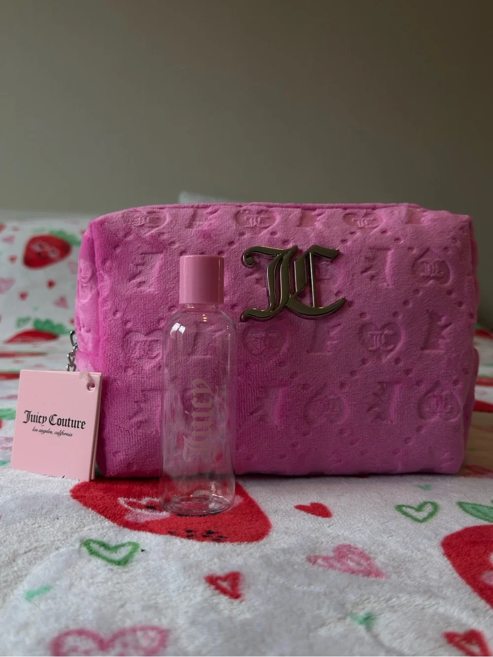 Pink Juicy Couture makeup bag with repeating 'JC' logo pattern 💖